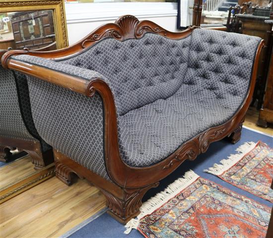 A Continental mid 19th century mahogany scroll-end settee W.185cm